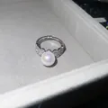 Close-up detail of a French retro zircon pearl open ring resting in a plush jewelry box - Style 1 Ring