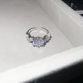 Detailed macro shot of a sparkling cubic zirconia flower open ring in a jewelry box - Style 4: Ring