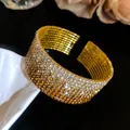 Close-up of a luxury vintage multi-layer elastic open bangle with gradient rhinestones - Gold Tone Coffee Brown Gradient