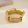 Close-up of vintage rectangular resin inlay and golden metal stretch bracelet for women - Western Retro Rectangle Patchwork (HB6097) / Gold-Beige