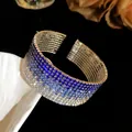 Detailed macro view of an elegant multi-layer gradient blue rhinestone open bangle - Silver Tone Dark Blue Gradient