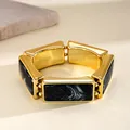 Close-up of vintage resin stretch bracelet with black marble pattern and gold-tone finish. - Western Retro Rectangle Patchwork (HB6097) / Gold-Black