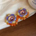 Vintage purple and gold enamel earrings with orange beads and rhinestone details - Purple-Orange