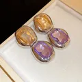 Close-up of elegant silver drop earrings with yellow and purple rectangle crystals - Silver Amber Purple Patchwork