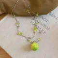 Elegant forest style necklace featuring a clear green apple pendant and silver bead chain - Green Apple Beaded Necklace