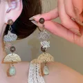 Vintage forest-style eucalyptus pod long earrings with maple leaf and stone drops - Mori Eucalyptus Fruit Pendant (HE33842) / Gold with Coffee