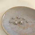 Detailed view of silver flower stud earrings set with pearls and zirconia - Style 2 Starfish