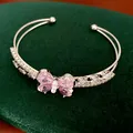 Detailed view of silver-toned bangle featuring a pink zircon butterfly and clear stones - Double-Layer Butterfly Open Bangle / Silver-Pink