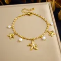 Détail des breloques étoile de mer dorée et perles sur bracelet en acier inoxydable - B2203 Bracelet