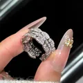 Luxury silver color open ring with scalloped edges and sparkling cubic zirconia stones. - Open Design / Silver