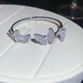 Detail view of a silver butterfly bangle encrusted with shimmering cubic zirconia stones - Butterfly Bangle (HB5633) / Silver