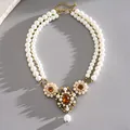 Close-up of vintage court style double-layer pearl necklace with floral accents - Gold-White-Amber (HN12622)