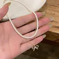 Elegante collana di perle a doppio strato in stile francese con pendente a fiocco in zircone. - Stile ciondolo a fiocco / Oro