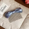 Close-up of elegant purple satin bow hair comb accessory on a beige canvas pouch - Hair Stick / Blue