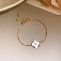 Elegant rose gold cherry blossom bracelet with pink shell petals and sparkling zircon stones. - Single Flower Mother of Pearl Bracelet (Side Inlay) / Pink Gold