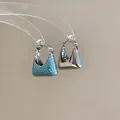 Detail view of 18k gold plated handbag-shaped earrings with vibrant turquoise zircon stones - Hoop Handbag Shape Style (Silver) / Blue