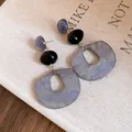Stylish acrylic oval pendant earrings featuring marbled purple finish and black beads - Gray