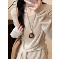 Retro resin oval pendant necklace with dark brown leather cord worn on beige sweater - Geometric Ring Buckle Style (HN12385) / Brown
