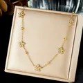 Macro view of gold-plated stainless steel necklace with crystal flower charms - Flower (N4428)