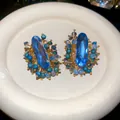 Vintage style oval blue crystal stud earrings with elegant bead details and gold finish - Streaming Flower Tassel (18# 925 Sterling Silver Earring Post) / Blue