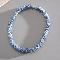Close-up view of blue and white faceted crystal beaded choker necklace with magnetic clasp - Necklace / Blue-Grey