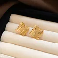 Close-up of vintage-style square gold stud earrings with textured surface in jewelry box - Silver Earring Post Style / Gold