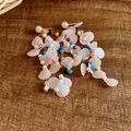 Detailed view of bohemian shell tassel earrings with colorful beads and pearl studs. - Silver Earring Post Style / Multicolor (Beige)