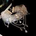 Close-up of an elegant rhinestone choker necklace with sparkling teardrop crystals - Water Drop Tassel Style / Silver