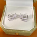 Detailed view of silver-toned star ear clips with sparkling zircon inlay in a gift box - Ear Clip (Pair) / Silver