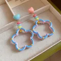 Macro view of colorful dopamine style hollow flower earrings with cute heart studs. - Multi-color (Silver Pin)