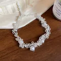 Detailed macro view of an elegant French style handmade beaded pearl necklace set - Necklace / White