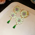 Detailed shot of elegant green chiffon flower earrings with dark green crystal drops - Hollow Base Crystal Pendant (36#)