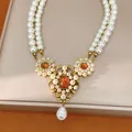 Detail of vintage court style double-strand pearl necklace with amber resin pendant - Gold-White-Coffee