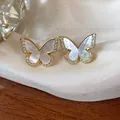 Close-up of 14k gold plated butterfly stud earrings with iridescent shell inlay - Iridescent Mother-of-Pearl Butterfly (10#) / Gold