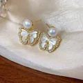 Close-up of elegant butterfly stud earrings featuring a pearl and sparkling zircon detail - Pearl Butterfly Pendant Style (1#) / Gold