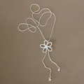 Detail view of a minimalist silver snake chain necklace with zircon flower pendant - Hollow Flower Style (HN12318) / Silver