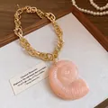 Vintage gold link necklace with peach acrylic conch shell pendant for beach vacations. - Conch (HN11845) / Pink