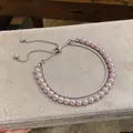 Close-up of elegant double-layer bracelet featuring pink pearls and zircon stones - Silver