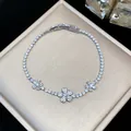Exquisite detail of a silver zircon butterfly bracelet with sparkling stones and folding clasp. - Silver-White-Flower