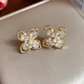 Exquisite 18k gold plated flower stud earrings featuring clear zirconia and pearls - Gold