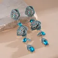 Eleganti orecchini vintage in argento con fiori, cristalli blu e perline di turchese - Orecchini Pendenti a Fiore Vuoto / Argento e Blu (Stile Lega)