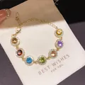 Elegante bracciale a catena dorata con vivaci zirconi tondi colorati con montatura halo - 1# Bracciale / Colorato