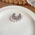 Macro detail of silver-toned double layer ear cuff with white pearls and sparkling cubic zirconia - Ear Bone Clip (Single) / 1 Piece / Silver