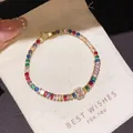 Elegant gold-plated tennis bracelet featuring vibrant multi-colored rainbow zircons and a pink gem - Style 14 Bracelet