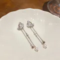 Elegant butterfly zircon stud earrings with long pearl tassels and delicate cross charms. - Butterfly Tassel (HE33162) / White