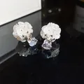 Close-up of elegant white flower double-sided stud earrings with sparkling crystals. - Front-Back Flower Style (HE34453) / Silver-White
