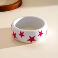 A detailed view of a wide white resin bangle with vibrant red star patterns for women - Five-pointed Star Pattern / White-Rose Red