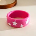 Detailed view of a vibrant pink resin bangle featuring white star patterns in dopamine style - Five-pointed Star Pattern / Pink