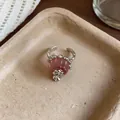 Detail of a silver open ring with a pink resin pudding charm and zircon accents. - Open Ring / Pink