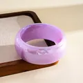 Detail shot of a translucent lavender resin bangle with subtle iridescent marble finish - Purple